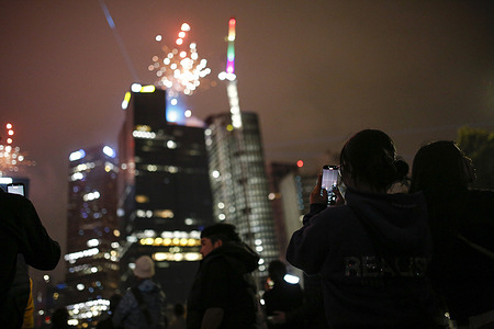 A woman is seen taking a photo during the New Year’s Eve fireworks in Melbourne. Melbourne welcomed the New Year with large-scale midnight fireworks across the city, drawing crowds to the CBD, riverside locations, and designated celebration zones. The annual event marked the transition into the new year with public festivities, live entertainment, and coordinated fireworks displays visible from multiple vantage points.