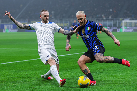 (R-L) Federico Dimarco of FC Internazionale and Manuel Lazzari of SS Lazio seen in action during Coppa Italia 2024/25 quarter finals football match between FC Internazionale and SS Lazio at San Siro Stadium. Final score : Inter 2 | 0 Lazio