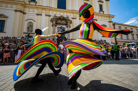 Colourfully-dressed performers dance together during the parade. Varsovians took to the streets to enjoy the 5th annual parade of the Mermaids. Celebrating the mermaid, the symbol of the city, the Warsaw districts came together to create a colourful procession of mermaids, bands, acrobats, dancers, and other performers, which moves from the Charles De Gaulle roundabout along the Royal Route to Castle Square.