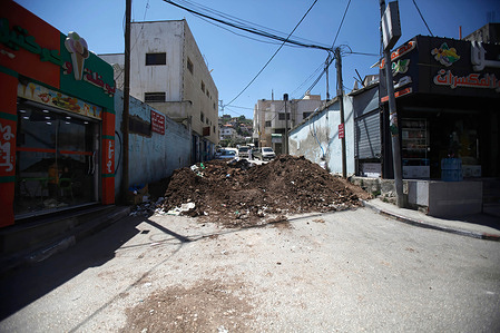 Earth mound placed by the Israeli army at the road leading to the market in the town of Huwara closing it off after young men from the town threw stones at Israeli vehicles.