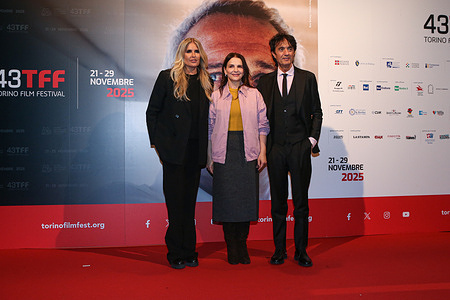 Tiziana Rocca (L), Juliette Binoche (C) and Giulio Base (R) attend the photo call on Day 5 of the 43rd Turin Film Festival in Turin.