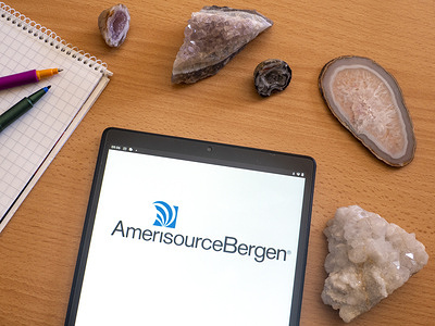 In this photo illustration, an AmerisourceBergen Corporation logo seen displayed on a tablet.