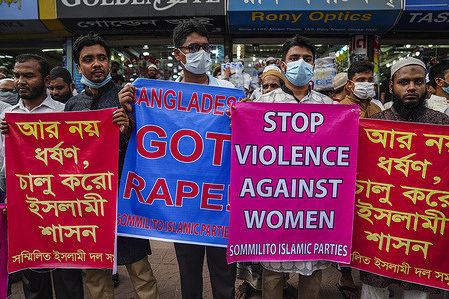 Activists of an Islamic group hold placards during the demonstration.
Activists of an Islamic group protest against an alleged gang rape and brutal torture of a woman in the southern district of Noakhali.