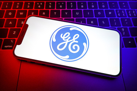 In this photo illustration, a General Electric logo seen displayed on a smartphone.