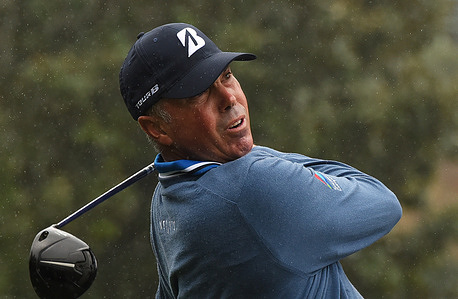 Matt Kuchar tees off on the first hole during the final round of the PNC Championship at the Ritz-Carlton Golf Club in Orlando, Florida.