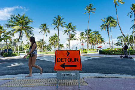 A detour sign stands at the intersection of 12th Street and Ocean Drive where the Florida Department of Transportation (FDOT) removed the art deco brick rainbow crosswalks a day earlier. The City of Miami Beach lost their appeal to keep the sidewalks.