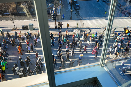 Protesters march during a demonstration against Immigration and Customs Enforcement (ICE). It is the second general strike in two weeks as the city protests ICE operations and the killing of Renee Good and Alex Pretti.