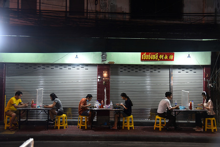 Customers at Yaowarat Street food have dinner at a street restaurant implementing social distancing as a precaution during the Coronavirus (COVID-19) crisis.
Thailand's Health Ministry has so far recorded a total of 3,000 infections, 55 deaths and 2,784 recovered since the beginning of the outbreak.