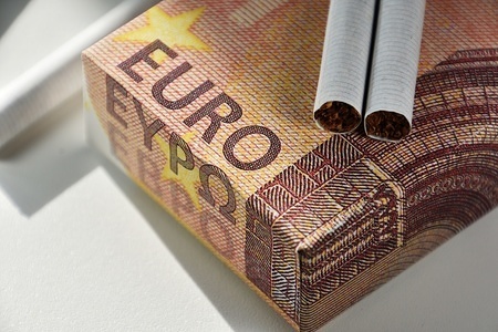 In this photo illustration a pack of cigarettes customised as a 10 euro currency note is being displayed.
With the new increase in tobacco prices in France, some packets of cigarettes have reached 10 euros.
