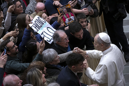 Pope Leo XIV greets the faithful at the end of his weekly general audience in paul VI Hall at the Vatican.