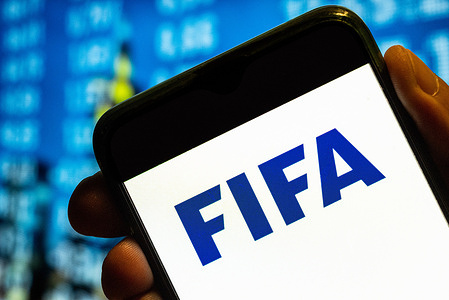 In this photo illustration, the Fédération Internationale de Football Association (FIFA) logo is displayed on a smartphone screen.
