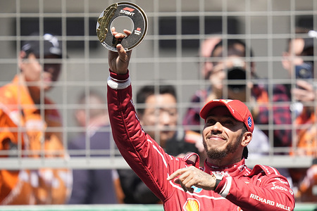 Sprint winner Lewis Hamilton of Great Britain and Scuderia Ferrari celebrates in parc ferme during the Sprint ahead of the F1 Grand Prix of China at Shanghai International Circuit.