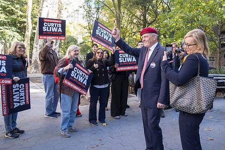 (L-R) Republican New York City mayoral candidate Curtis Sliwa and Nancy Regula exit poll site after casting their vote on first day of early voting in New York at the poll site at the Richard Gilder Center for Science, Education, and Innovation in New York City.
