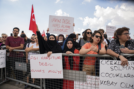 Protesters holds placards during the demonstration.
More than a thousand people have demonstrated in Istanbul against Covid-19 vaccinations, testing and no masks.