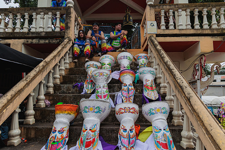 Phi Ta Khon masks seen on the temple stairs after the parade ended. Phi Ta Khon, also known as the "Ghost Festival", is a vibrant and unique festival held in Dan Sai, Loei province, Thailand, during the rainy season, usually between late June and early July.
It is one of the most unique and colorfull festivals in the country, known for its vibrant masks, traditional music, and lively processions.