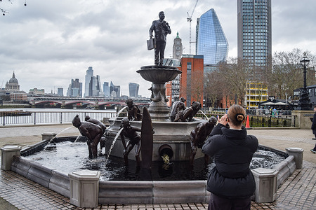 A fountain depicting swimmers and surfers vomiting dirty water while a businessman stands above them holding a briefcase and cash has been unveiled in South Bank to promote Channel 4’s docudrama TV series "Dirty Business" to portray the investigation of the water company sewage scandal.