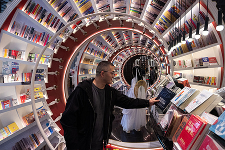 A man seen looking at a book at the Zhongshuge bookshop in Shenzhen, China.
