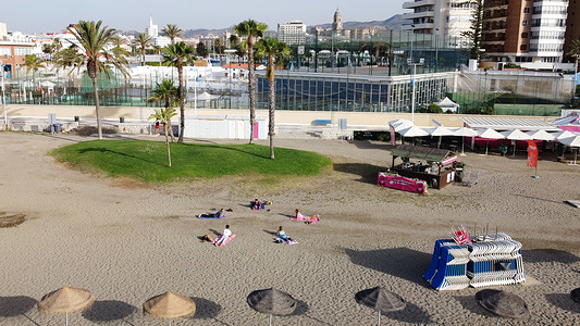 People practicing yoga at the beach in front of Mein Schiff 2 Cruise Ship in Malaga.
Mein Schiff 2 is the first international cruise that has docked at Iberian Peninsula since Covid19 pandemic started. Spain lifted the ban for international cruise ships to dock in Spanish ports on May 30th.