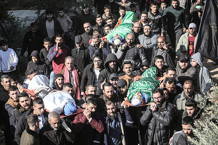 (EDITORS NOTE: Image depicts death)
Palestinians attend the funeral of nine Palestinians in the town of Tamoun near Tubas. Ten Palestinians were killed in an Israeli drone strike in the town of Tamoun near Tubas.