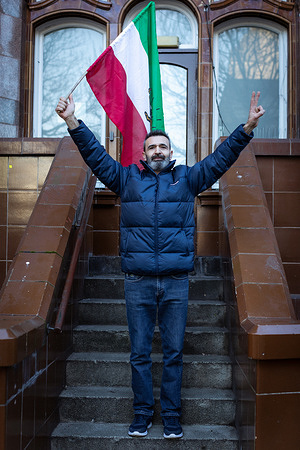 An Iranian supporter holds a flag during an anti-Iranian government protest Protests have erupted globally after the news of people being killed by the Islamic Republic regime while taking part in protests across Iran. The demonstrations are a result of the country's worsening economic situation, with an inflation rate of nearly 50% the people of Iran want change.