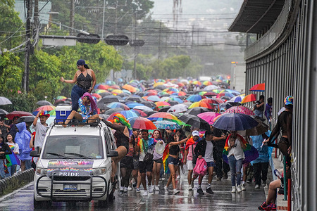 Demonstrators march during the Pride Parade in San Salvador, El Salvador.