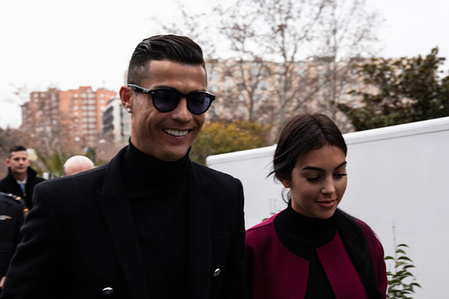 Portuguese soccer player Cristiano Ronaldo arrives at the provincial court of Madrid with his girlfriend Georgina Rodriguez for his tax evasion trial.