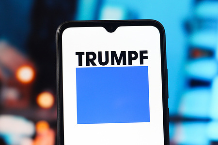 In this photo illustration, the TRUMPF logo is seen displayed on a smartphone screen.