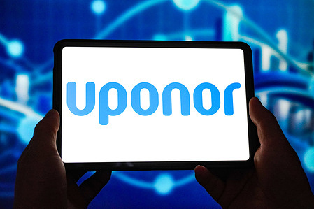 In this photo illustration, the Uponor logo is displayed on the screen of a smart tablet.