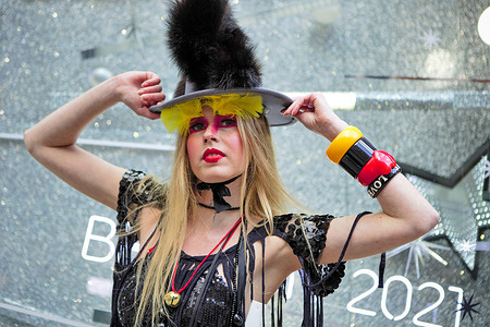 A model showcases Pierre Garroudi's latest colourful collection at one of the designer's speciality flash mob fashion show at Knightsbridge in London