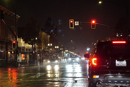 Cars seen on the road during a strong storm. A strong storm hit San Francisco Bay Area with gusty winds and heavy rain on March 21. The strong storm caused a lot of issues and accidents all around the northern California, such as power outage, downed trees, traffic accident and glass falling. Due to the strong storm, public transition services including ferry and bus suspended. At least one person died and multiple injured because of the storm on March 21.