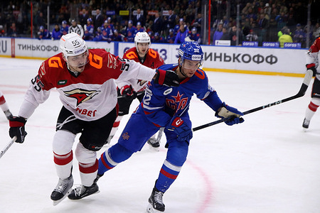 Avangard Hockey Club player, Bogdan Kiselevich (55) and SKA Hockey Club player, Andrei Chivilyov (92) seen in action during the Kontinental Hockey League, regular season KHL 2023 - 2024 between SKA Saint Petersburg and Avangard Omsk at the Ice Sports Palace. 
(Final score; SKA Saint Petersburg 3:5 Avangard Omsk)