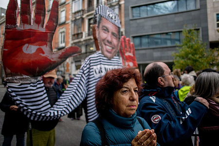 Protesters hold up a giant image of Carlos Mazon, during a demonstration. Several people affected by the DANA (Depresión Aislada en Niveles Altos - or isolated high-altitude depression) staged a demonstration outside the Congress of Deputies in Madrid, during the appearance of Carlos Mazon, acting president of the Valencian Generalitat, who was answering questions before the commission investigating his handling of the DANA related catastrophe in 2024 that left 229 dead in Valencia alone. DANA events can cause torrential downpours, leading to dangerous flooding.