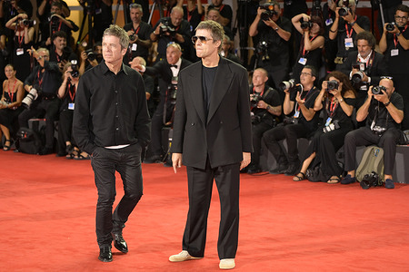 Noel Gallagher (r) and Liam Gallagher (l) attend the red carpet of movie Oasis Don't look back in anger at Palazzo del Cinema during the 83rd Venice Film Festival.