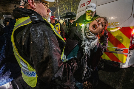 A pro-Palestinian activist is being arrested for trespassing onto the grounds of HMP Wormwood Scrubs prison during the rally. Scores of pro-Palestinian demonstrators protesting the incarceration of Palestine Action activists at HMP Wormwood Scrubs were arrested for aggravated trespass after entering prison property. Police kettled the group and carried out arrests one by one in a large-scale operation that lasted around five hours.