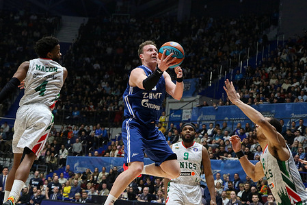 Dmitry Kulagin (C) of Zenit St Petersburg and Marcos Knight (No.9), Daryl Macon (No.4) of UNICS Kazan in action during the VTB United League basketball match, 1/2 Playoff Finals, match 3, between Zenit St Petersburg and UNICS Kazan at Sibur Arena. Final score; Zenit 83:71 UNICS.