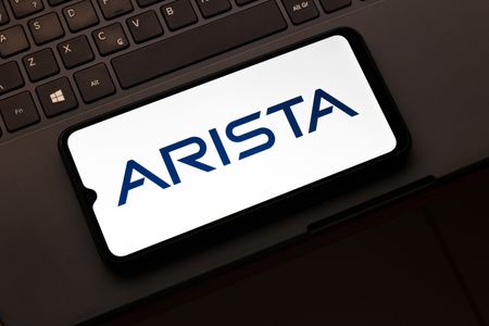 In this photo illustration, the Arista Networks logo is seen displayed on a smartphone screen.