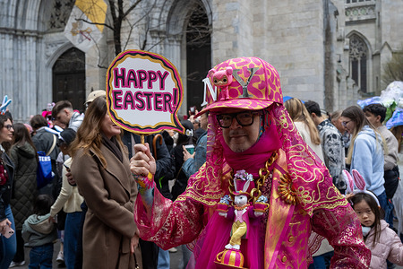 People with colorful costumes and hats participate at the annual Easter Parade and Bonnet Festival outside of St. Patrick's Cathedral in New York City.