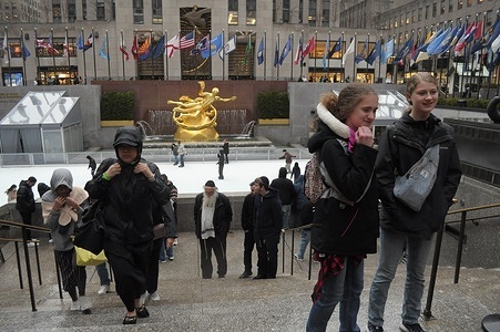 People take photos in Rockefeller Center, Manhattan, New York City.