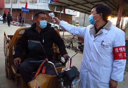 Village workers measured the temperature of travellers at an epidemic prevention and control checkpoint in Luzhai Town, Linquan County, Anhui Province which is one of the high-risk areas for COVID-19.
On February 20, 2020, COVID-19 coronavirus killed more than 2,100 people in China and infected more than 74,000 people.