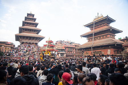 Nepalese devotees celebrate and pull the chariot of Lord Bhairab to mark the beginning of the Biska Jatra festival. The Biska: Jatra starts the countdown for the Nepali New Year which begins with the two groups of locals engaging in a tug-of-war to pull the Lord Bhairav chariot to either side of the city area.