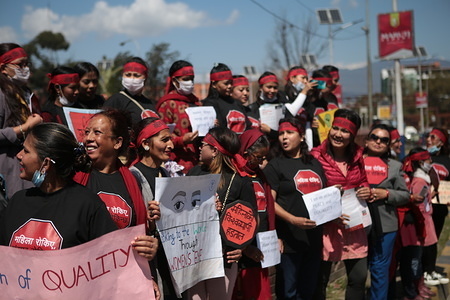 Women hold placards during the protest.
International Women’s Day is an official holiday for women. Women took to the streets, protesting against the women's inequality and sexual violence.