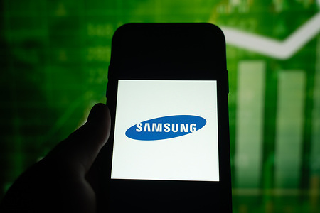 In this photo illustration, a Samsung logo seen displayed on a smartphone.