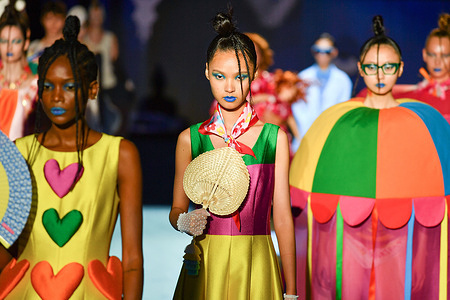 Models walk the runway wearing a design by Agatha Ruiz De La Prada during Mercedes-Benz Fashion Week de Madrid in IFERMA.