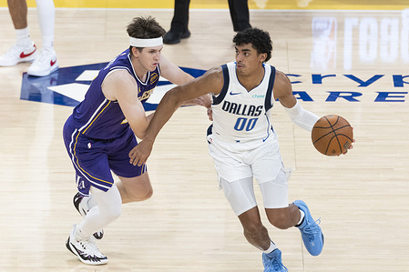 Dallas Mavericks' Max Christie #00 is defended by Los Angeles Lakers’ Austin Reaves (15) during an NBA basketball game between Dallas Mavericks and Los Angeles Lakers at Crypto.com Arena.