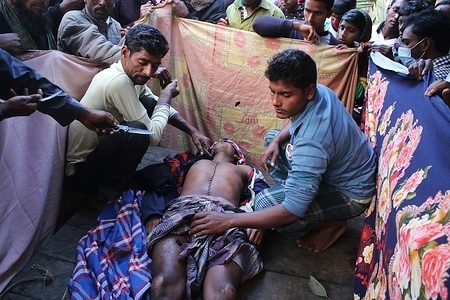 (EDITORS NOTE: Image depicts death)
Local people prepare to bury the body of Rabiul Islam, a Bangladeshi worker who was shot dead by the Indian Border Security Force (BSF), in the village of Baliadangi in Thakurgaon.
The man along with his associates decided to cross the border at Betna and trespass into India early on Tuesday to bring home cattle illegally police officials reported. In the first ten months of 2020, a total of 40 people have been killed in border violence on the Indo-Bangla border.