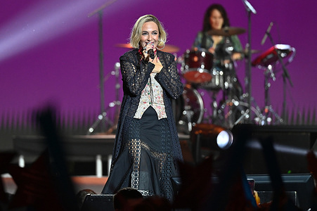 Paula Mattheus performs during the solidarity concert of Cadena 100 Por ELLAS at the Movistar Arena in Madrid.