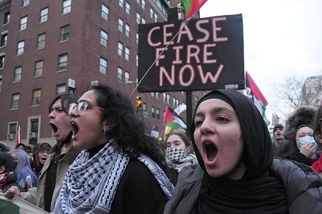 Pro-Palestine demonstrators carry Palestinian flags and placards expressing their opinion at a rally. Demonstrators supporting Palestine marched near Columbia University in Manhattan, New York City demanding a permanent ceasefire in the war between Israel and Hamas, and an end to the Israeli military’s bombardment of Gaza. According to Gaza's Health Ministry, more than 27,000 people have been killed in Gaza since the war started on October 7, 2023.