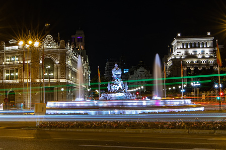 Nighttime panorama of Plaza de Cibeles in Madrid.