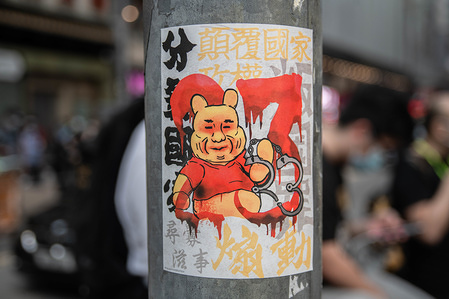 A sticker with Xi Jinping as the cartoon character, Winnie the Poo during the demonstration.
Defying the gathering ban that followed the covid 19 pandemic, protesters demonstrate against Hong Kong government and Chief Executive Carrie Lam on Labour Day, 1st May.
