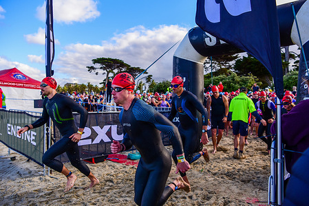 Triathletes seen in action at the start of the race Race 3 of the 2XU Triathlon Series 2025-2026 at St Kilda Beach.